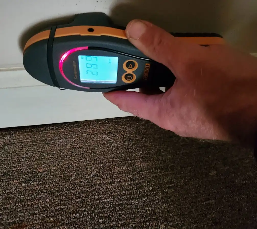 Moisture detection at baseboard during Storm Damage Restoration in Woodlake
